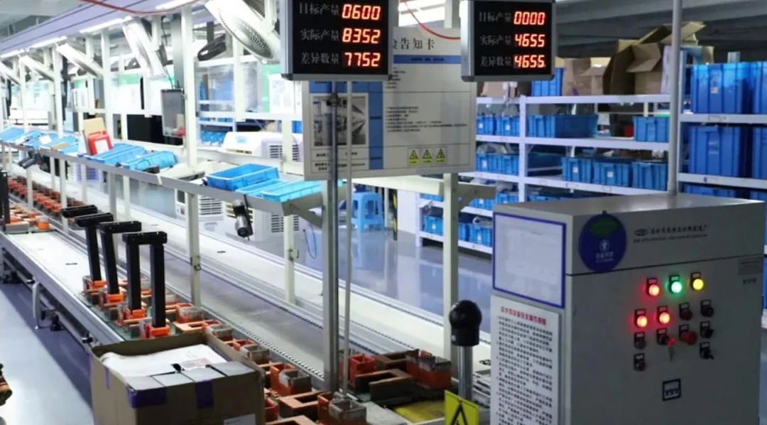 NATE assembly line with workstations and component bins