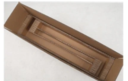 Long desk component secured inside a honeycomb cardboard insert