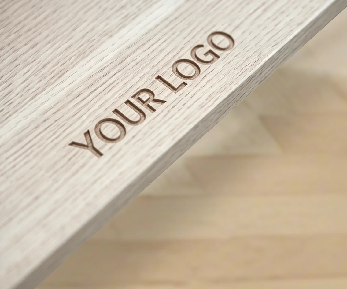 Custom brand marking on a dark metal surface