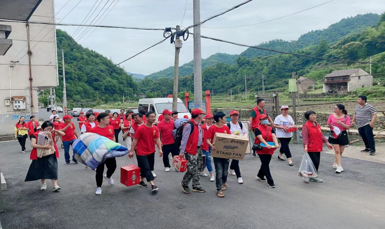 Volunteers bringing household supplies during a community visit